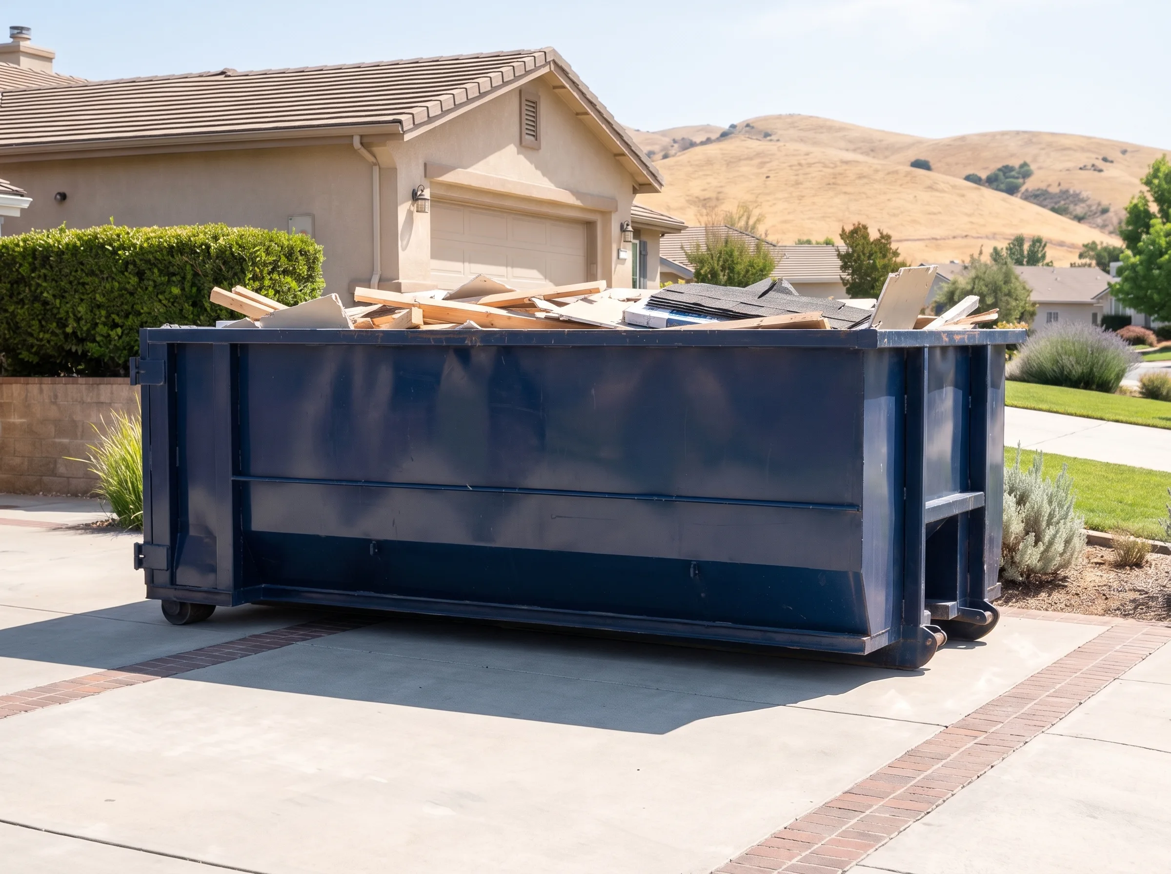 Roll-off dumpster being loaded in El Dorado County, CA